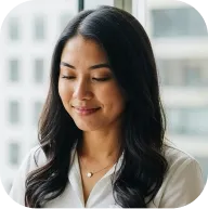 Happy female Deriv partner laughing after earning commission from affiliate referrals