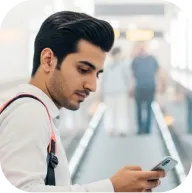 Young professional browsing live market charts on their mobile device